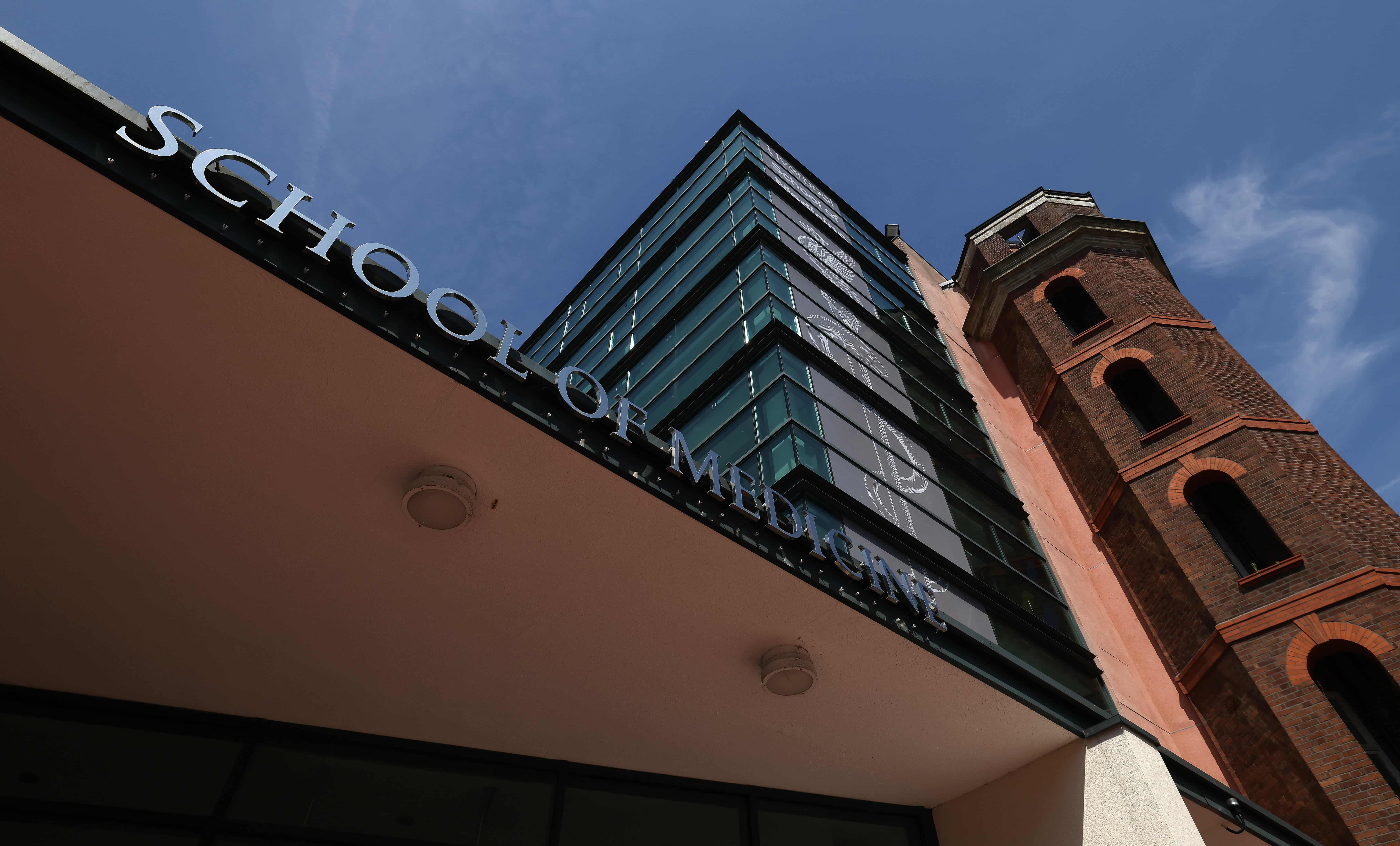 A view of the exterior of the School of Medicine at University of Liverpool on a sunny day.