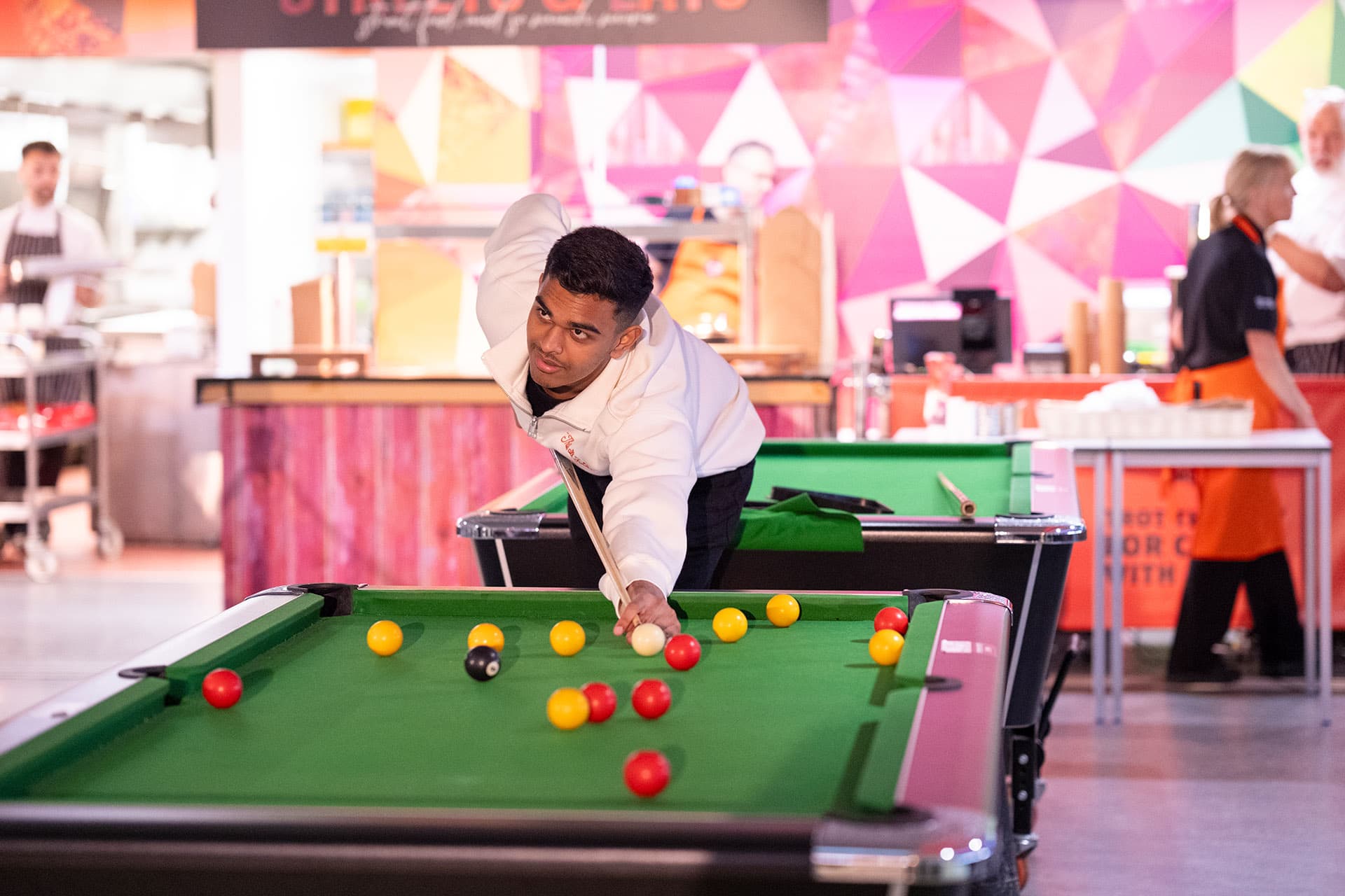 Student playing pool in the Guild of Students