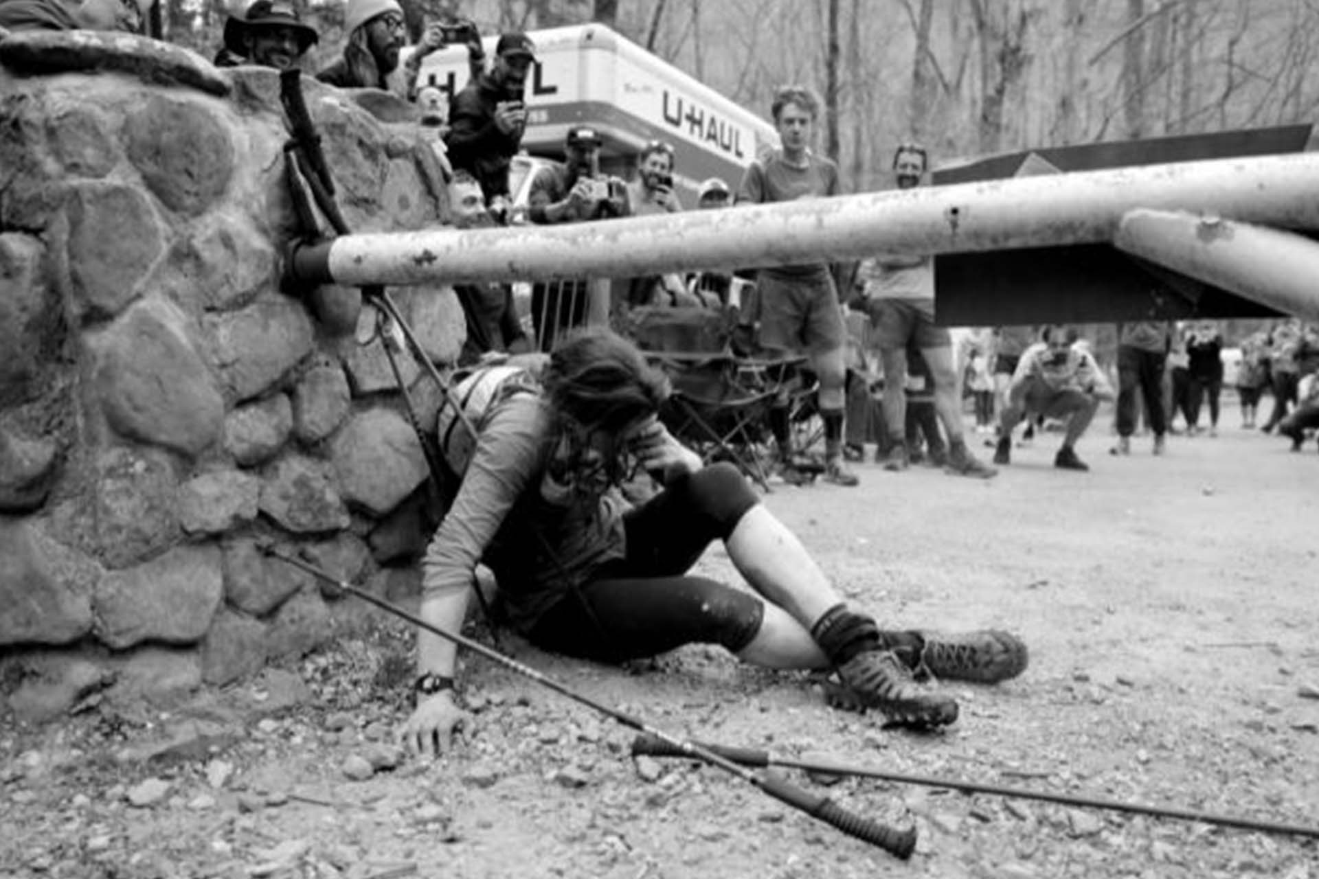 Woman sitting on the floor after completing marathon