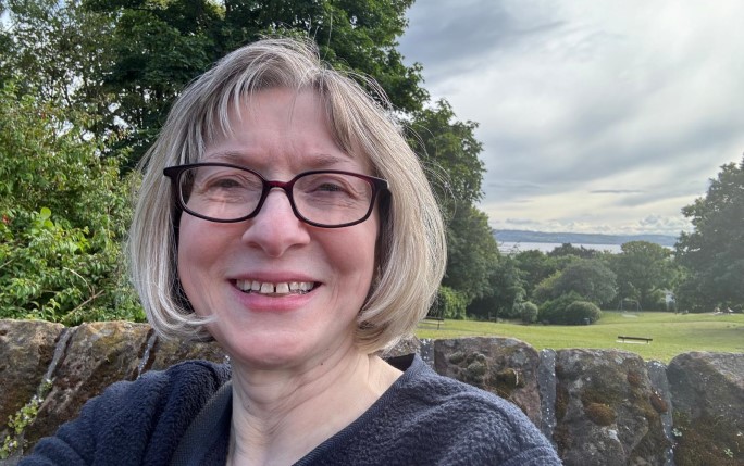 Donor Barbara Lloyd standing in front of a field