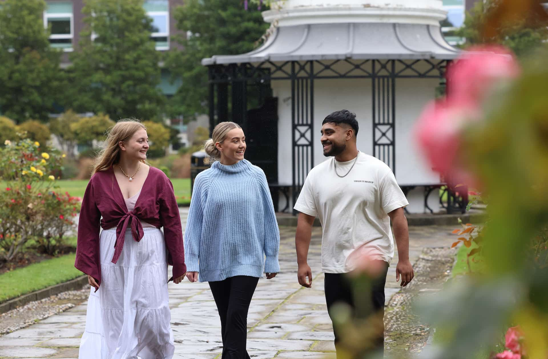 Three students walking in abercromby square