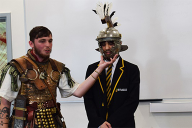 Students wearing Roman costumes
