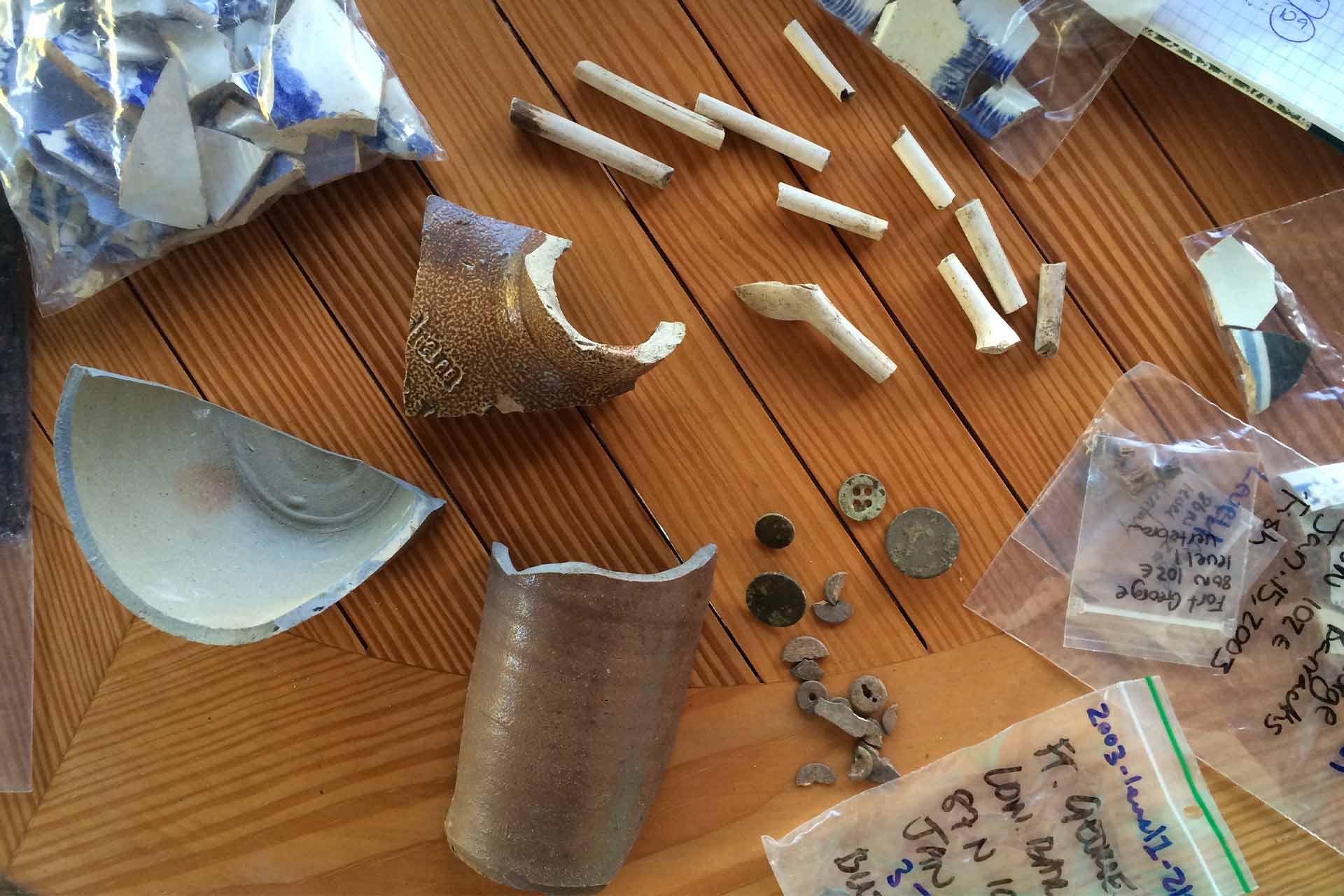 Findings from Betty's Hope plantation in Antigua and Barbuda: porcelain sherds, remains of a stoneware rum bottle, and kaolin tobacco pipes