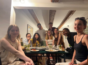 A group of people enjoying an evening meal.