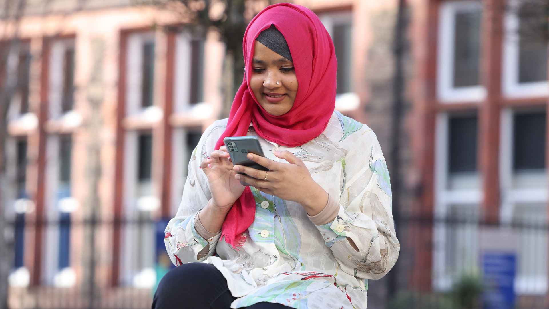 student looking at her mobile