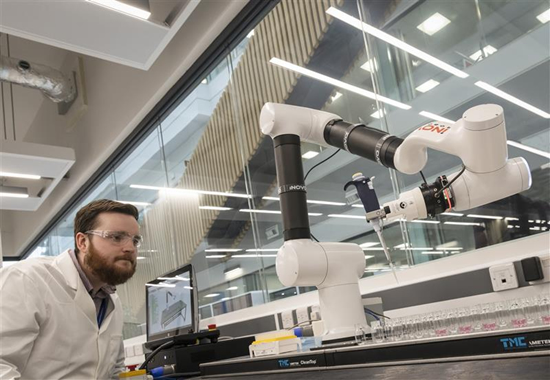person in chemistry lab using equiptment