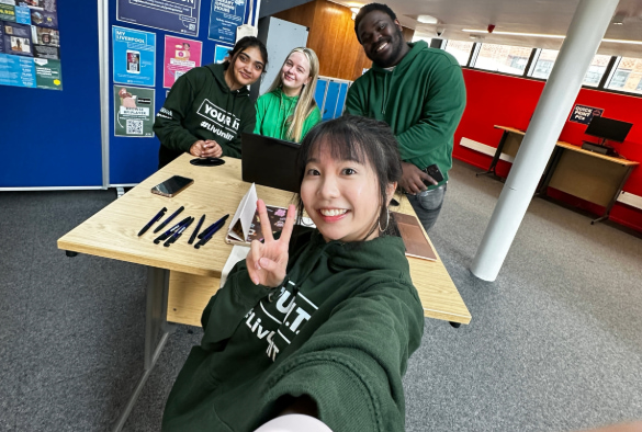 Selfie of four IT Services Coaches posing at a drop-in event