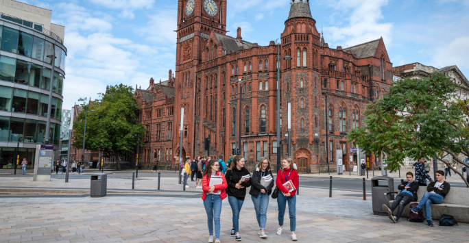 Group of students walking in front of the VG&M