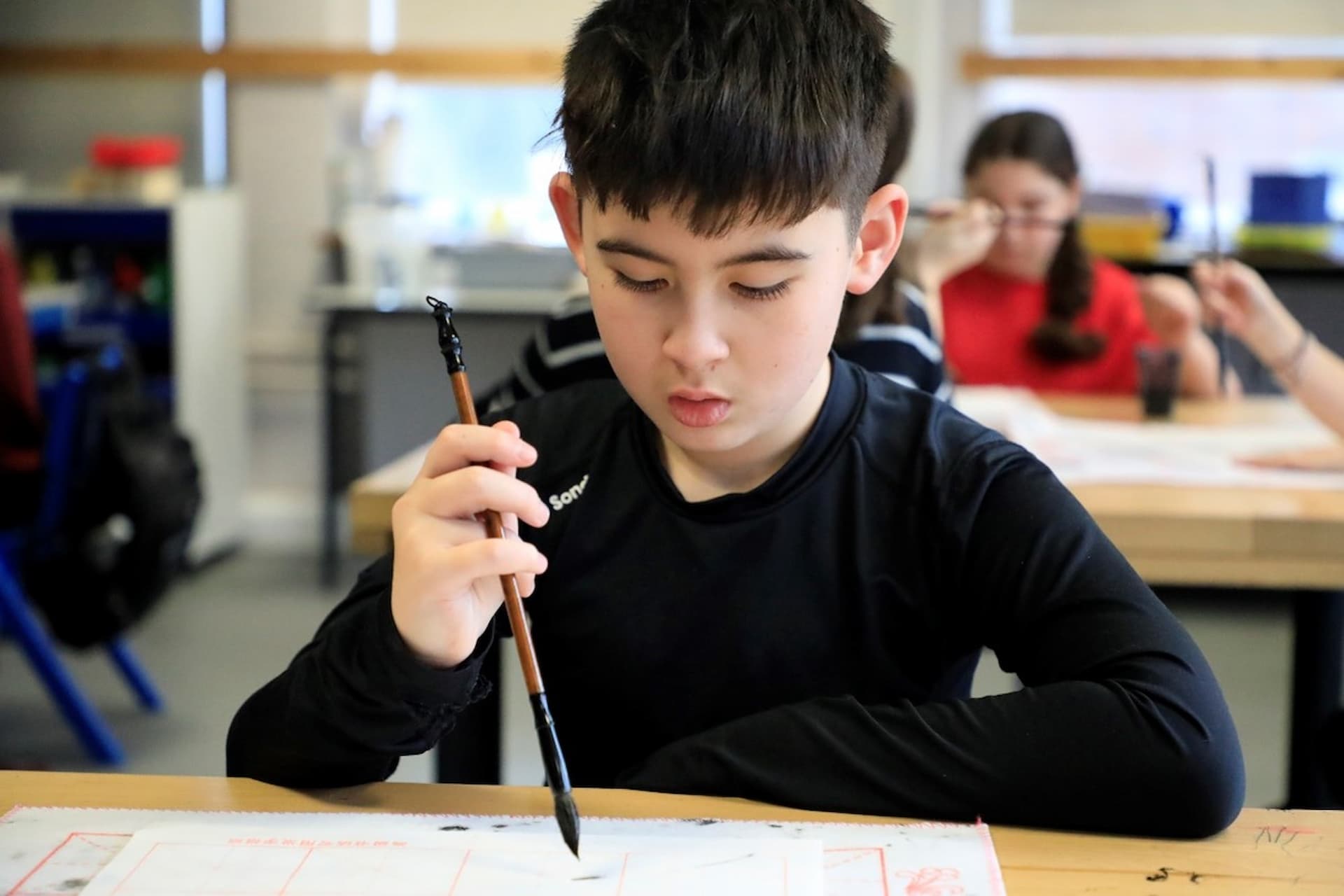 Child doing Chinese calligraphy