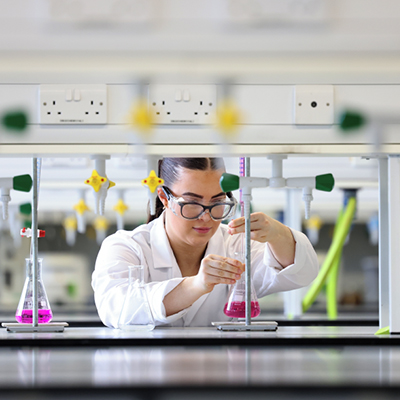 Student in Lab using equipment