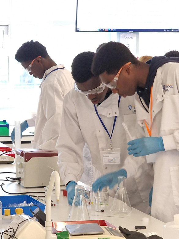 Students taking part in an experiment in the laboratory during the Black Science Bootcamp