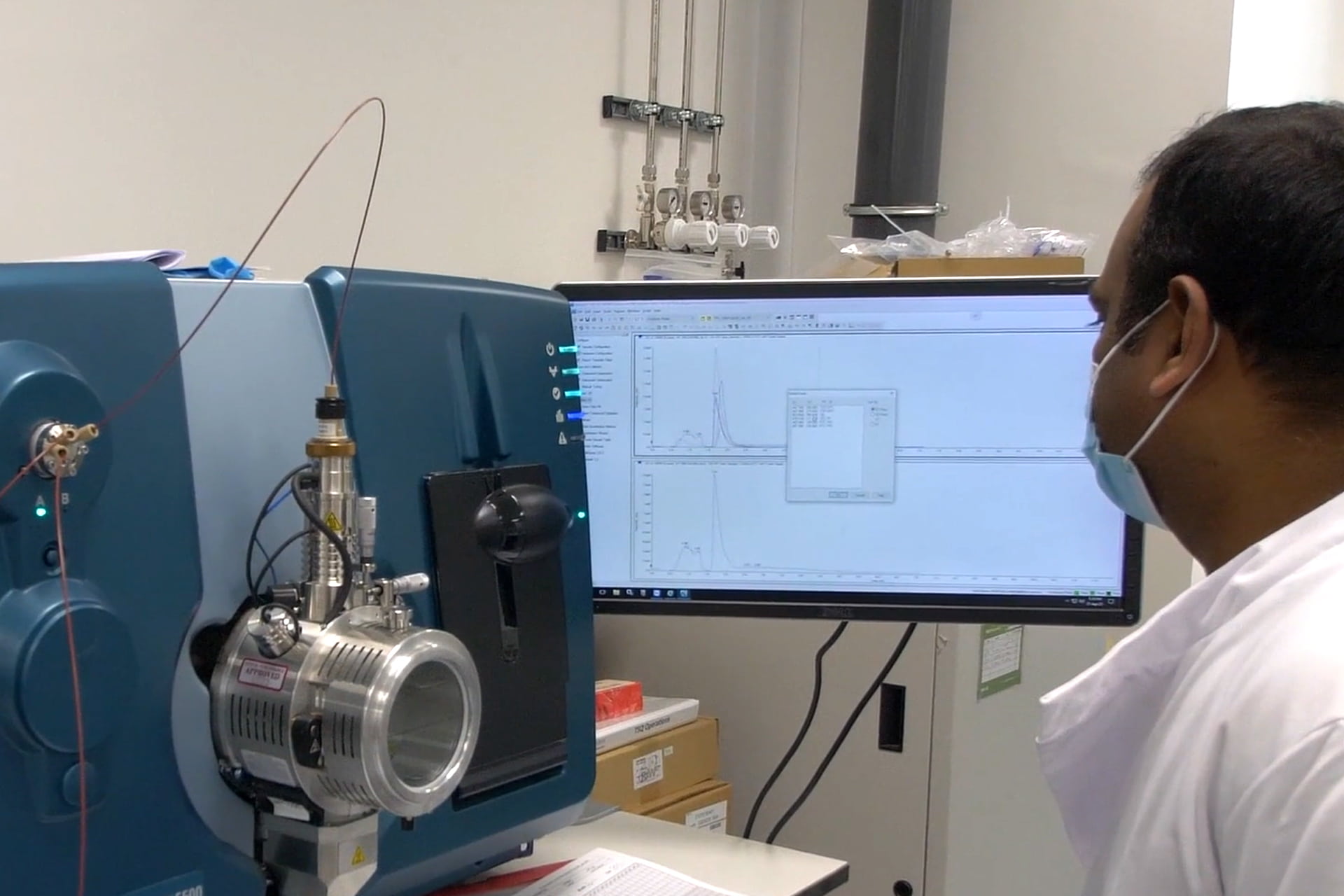 Researcher using mass spectrometer in the lab