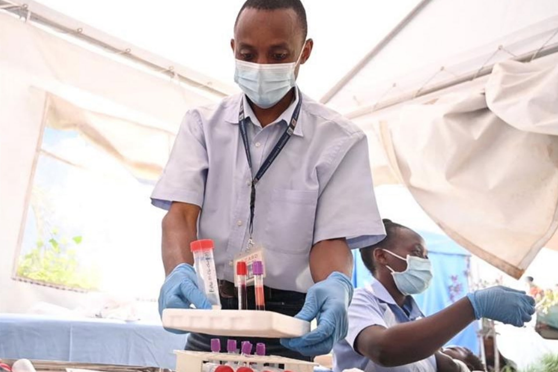 Scientist carrying samples