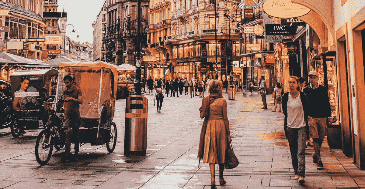 A street view of Vienna with a lady walking in the foreground