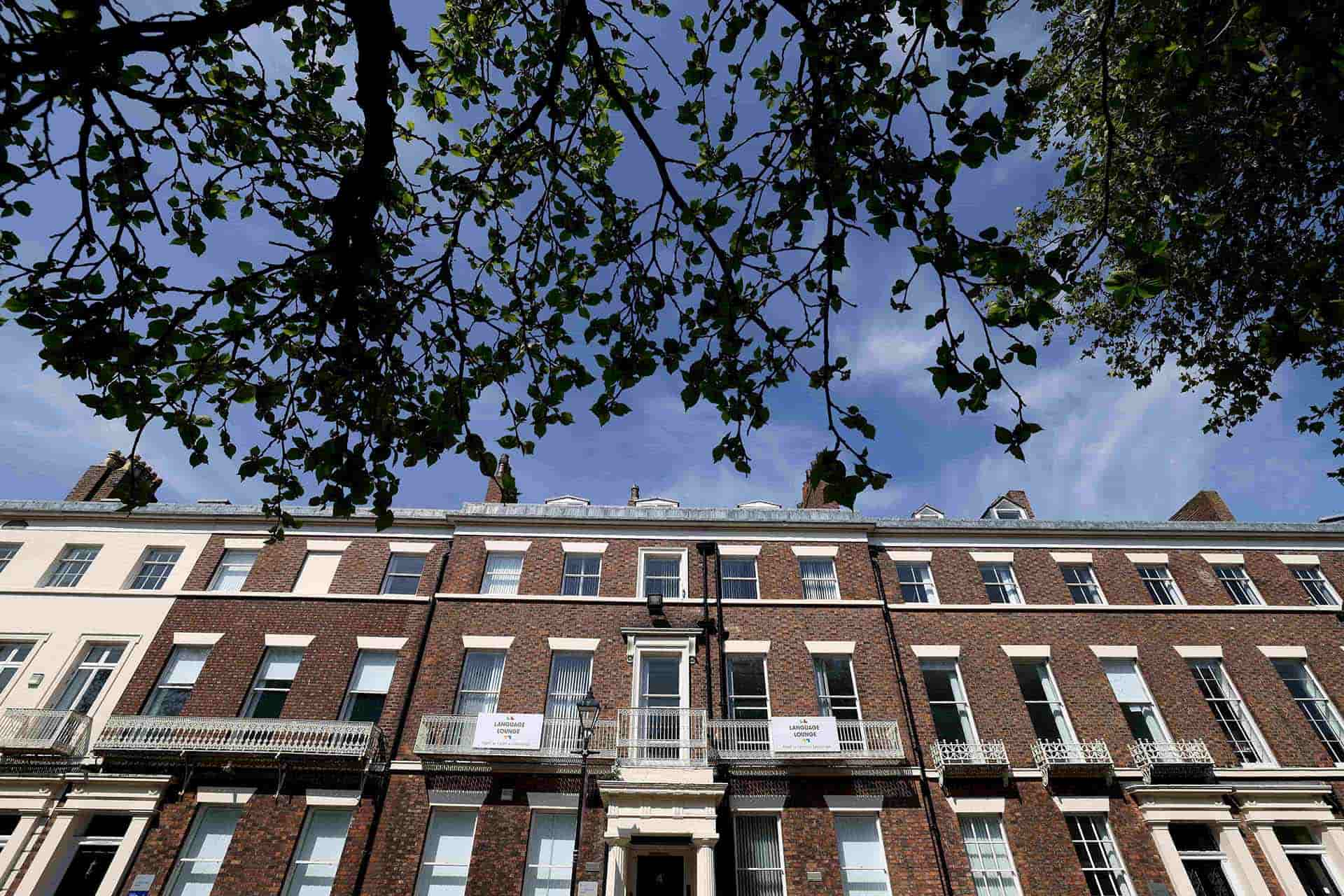 Georgian terrace buildings with a tree in the forefront