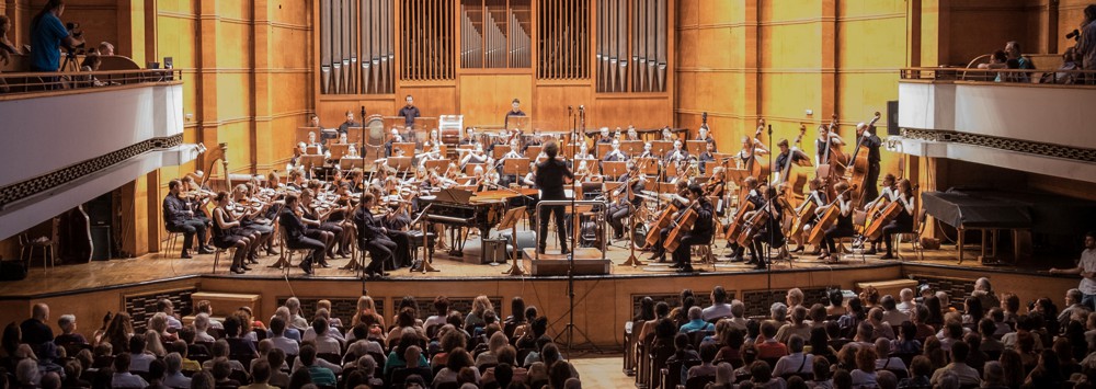 A concert hall where an orchestra is playing