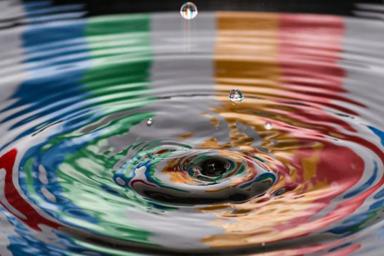 Colours reflecting in a water ripple