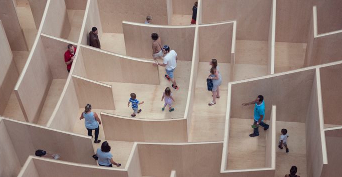 People walking through a maze