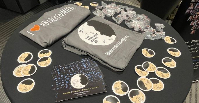 Table with promotional materials for Black in Microbiology