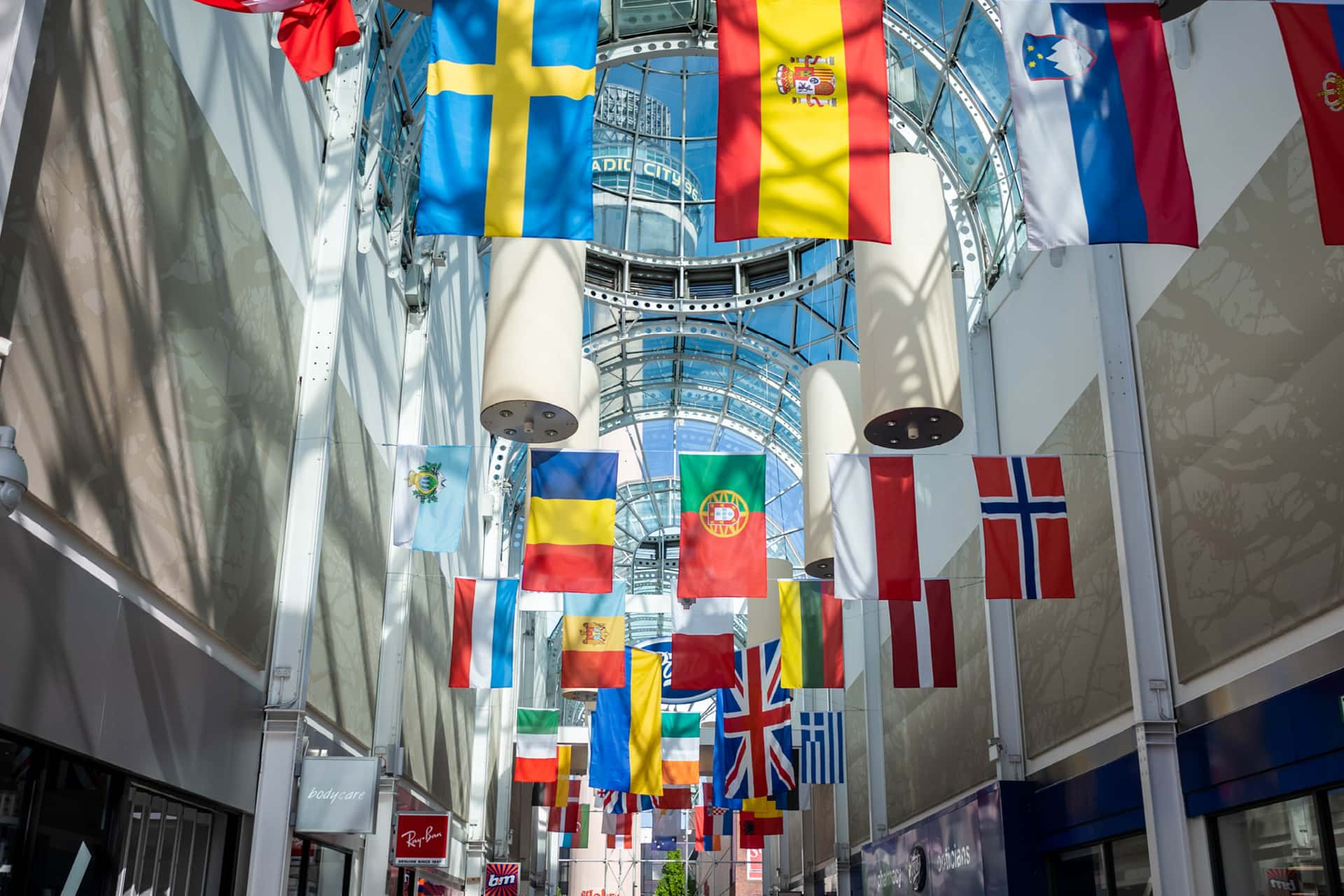 Flags from across the world hanging from the ceiling in Liverpool.