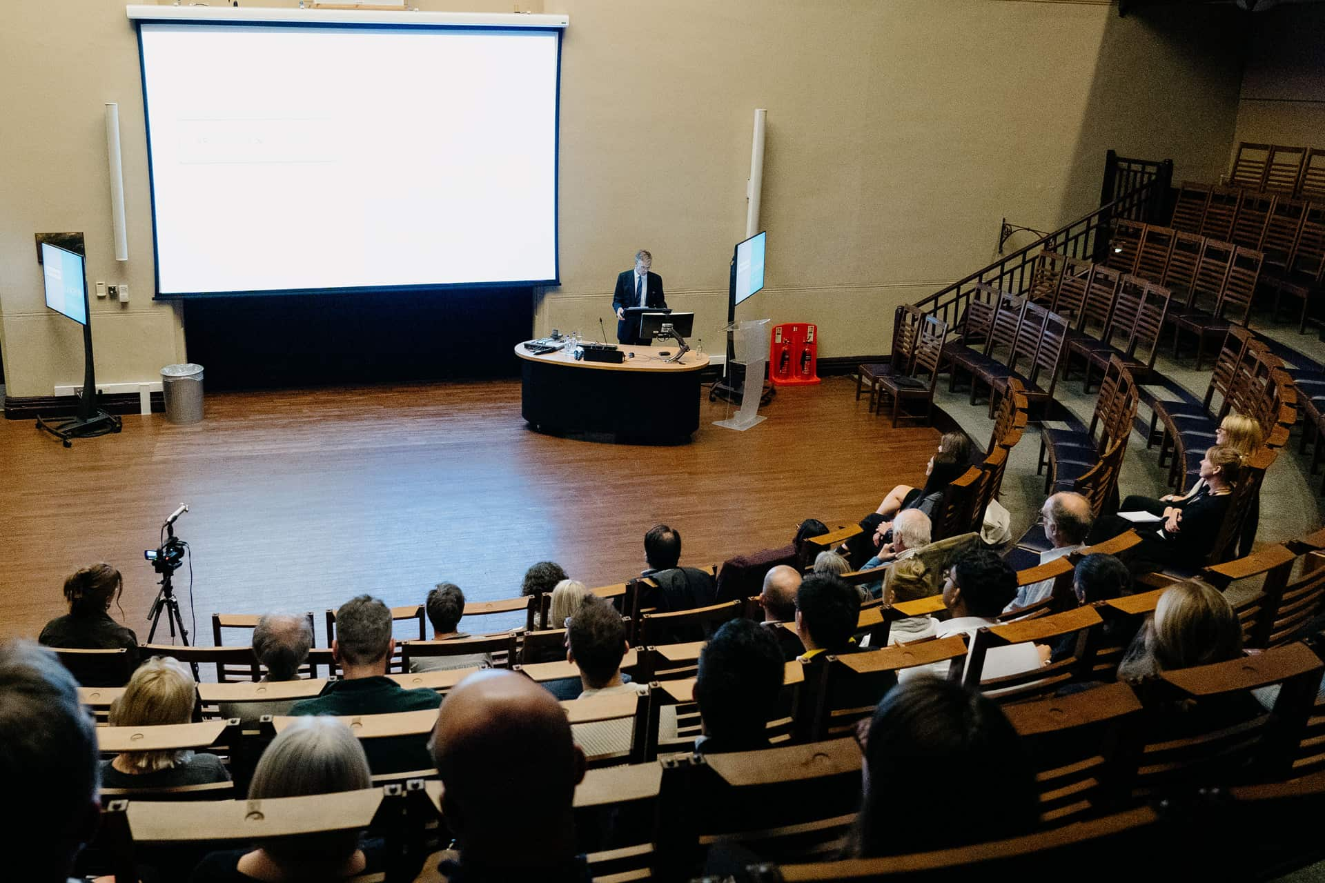 A lecture theatre filled with people.