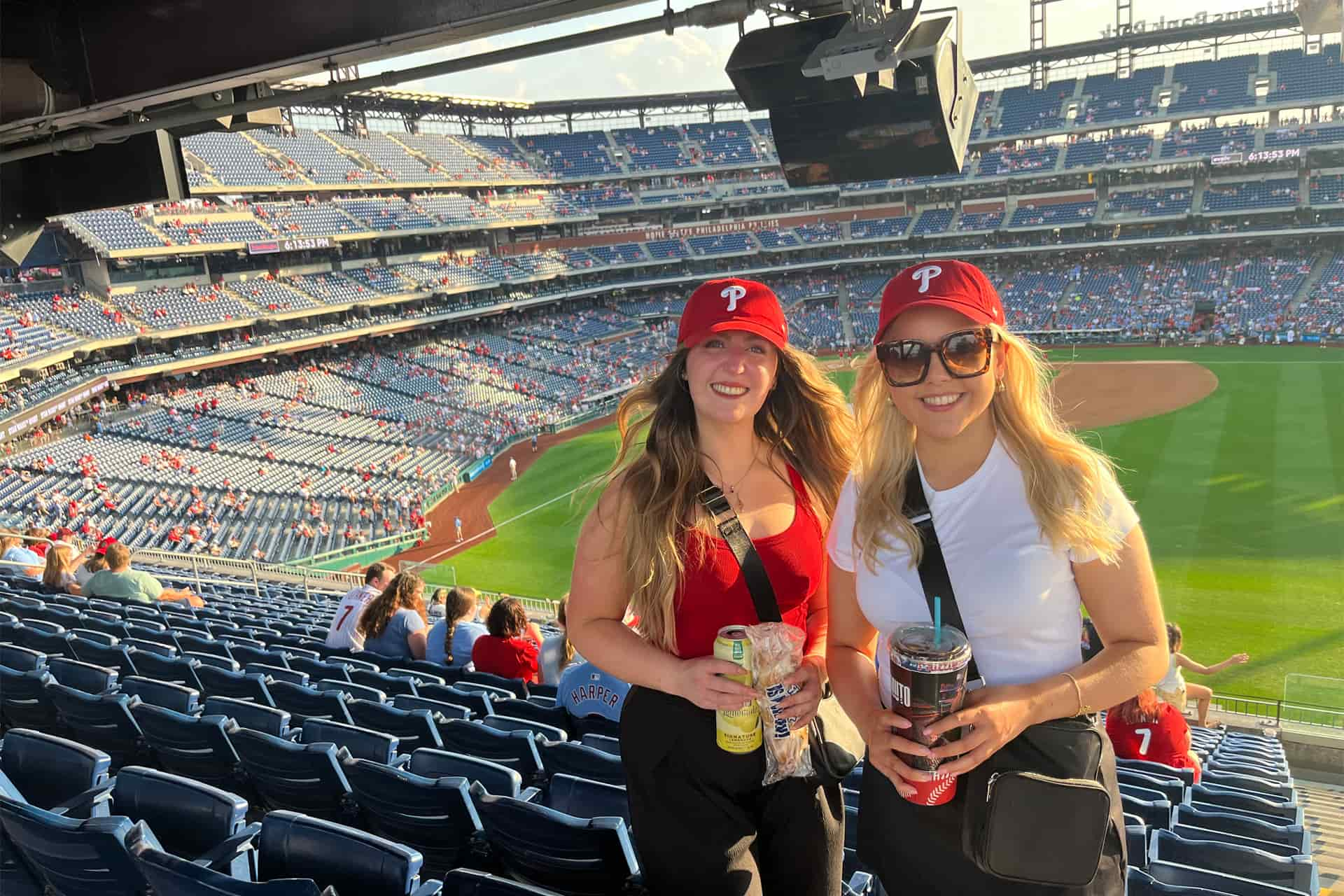 Elizabeth stands with her friend in the Citizens Bank Park baseball stadium.