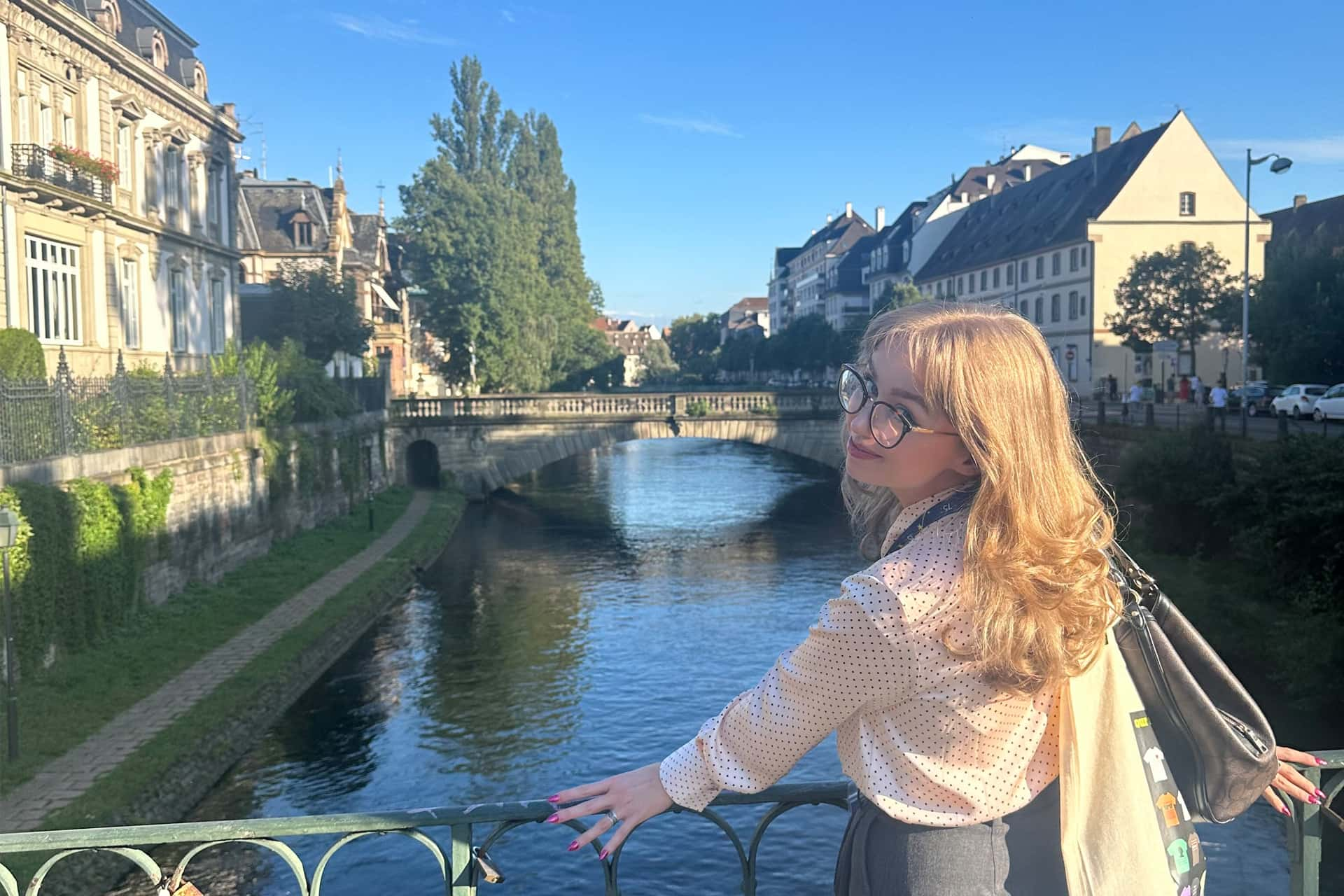 Stephanie Whelan stands at a bridge in Strasbourg.