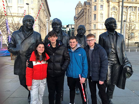Luca and friends with Beatles statue at the Pier Head