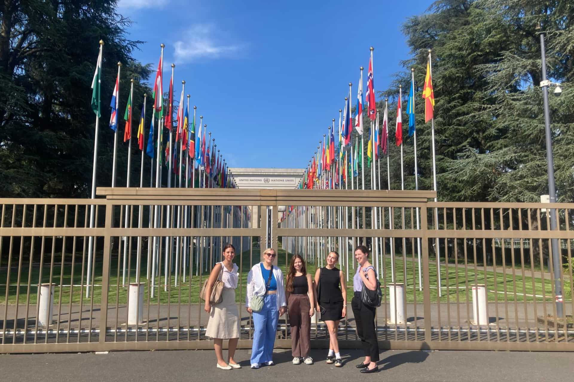 Students stand in front of the UN Headquarters.