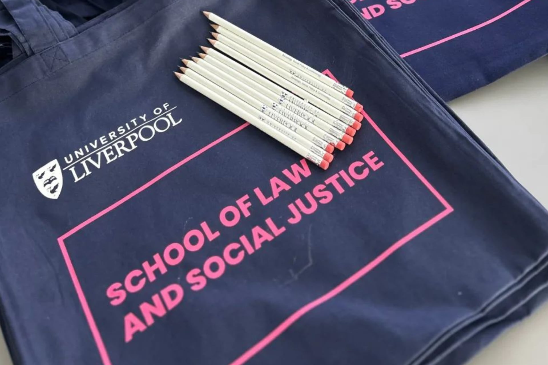 School of Law and Social Justice tote bags and pencils