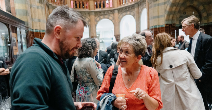 Guests talking to each other at the wine reception