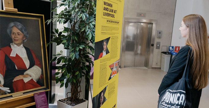 A student looking at the 'Women and Law at Liverpool exhibition'