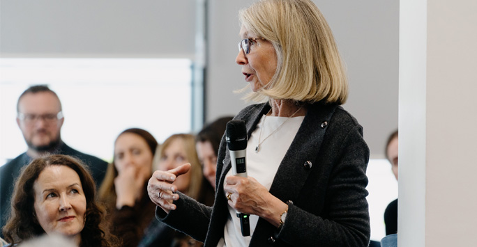 A guests asking a question at the panelist talk