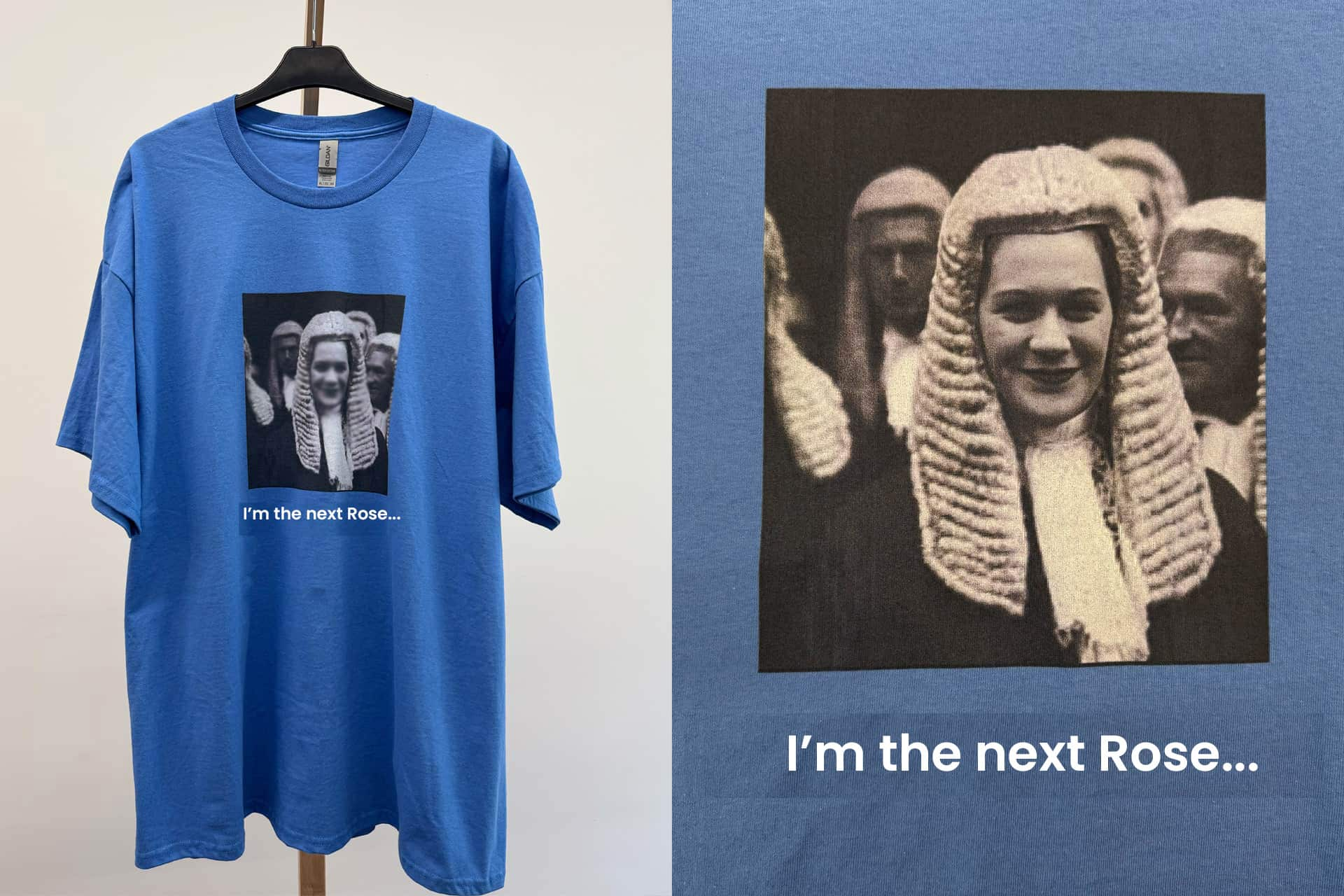 A blue tshirt with a black and white image of people dressed in judge wigs and cloaks.