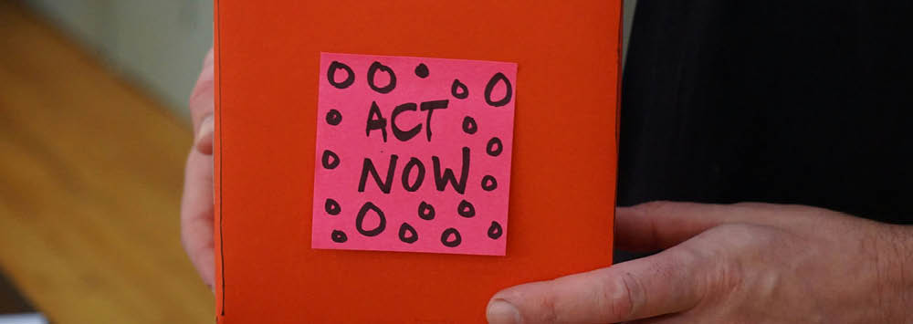 Red box with act now written on it.