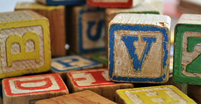 Wooden blocks with the alphabet on them.