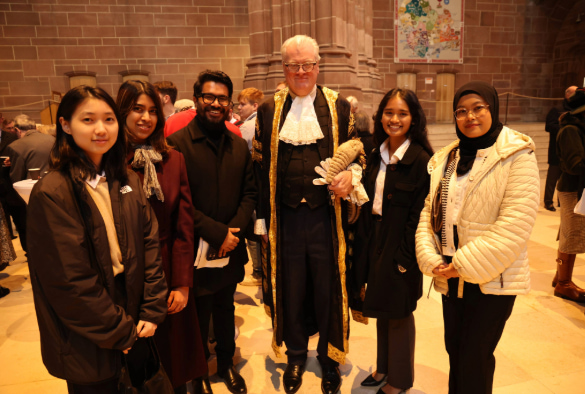 Liverpool Law Students stood with a Judge.