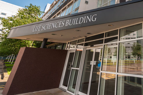 A photo of the outside of the Life Sciences Building showing the entrance