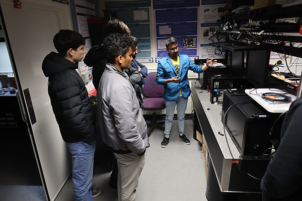 People visiting a lab.