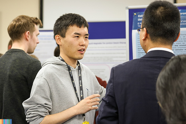 A student presenting a poster.