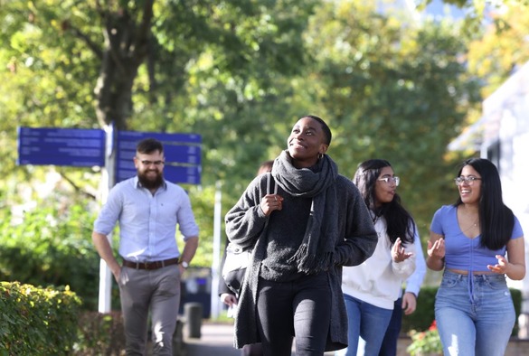 Personal,  Tulela Pea walking on campus with people behind - William Norcup Brown, Lynsey Shale, Praleena Mohan, Jorge Mauricio and Alejandra Cenielli Hinojosa Martinez