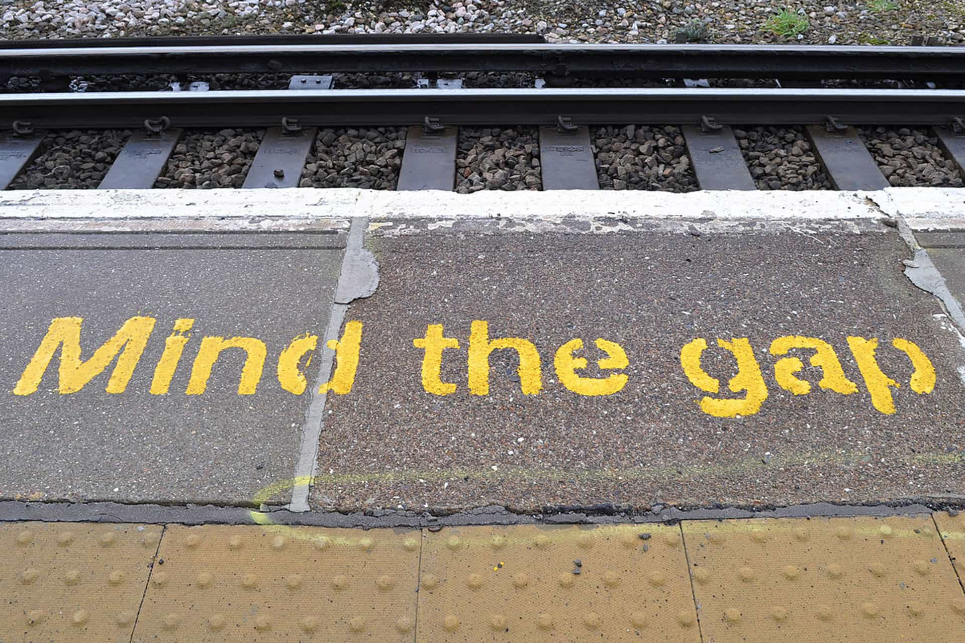 Text saying 'Mind the gap' on a train platform