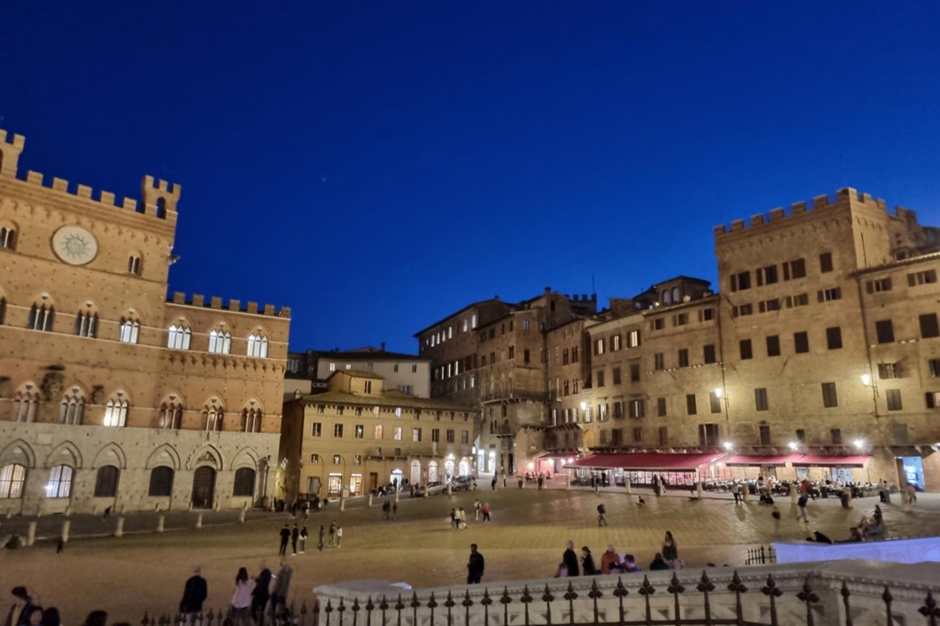 A European town square in the evening with old stone buildings