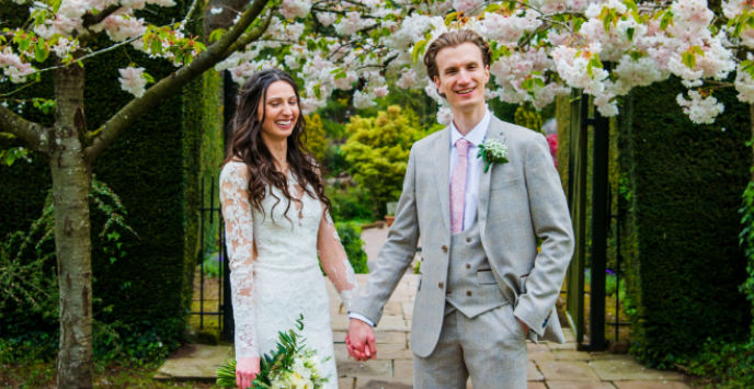 A bride and groom on the day of their wedding at Ness