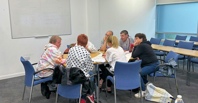Attendees at the PPIE event discussing the care those with learning disabilities receive within the community