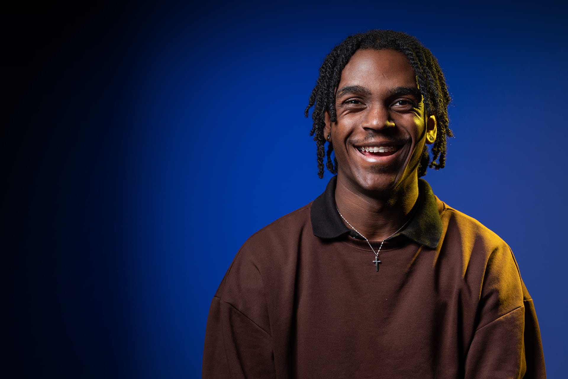 Undergraduate student smiling at the camera