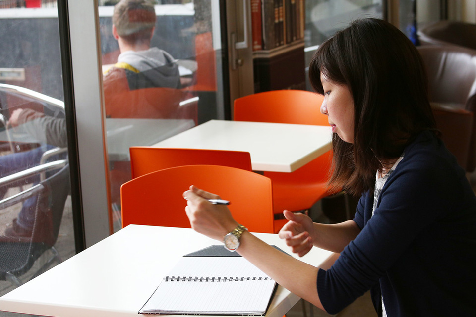 Close up of student sitting at a table in the Sydney Jones cafe