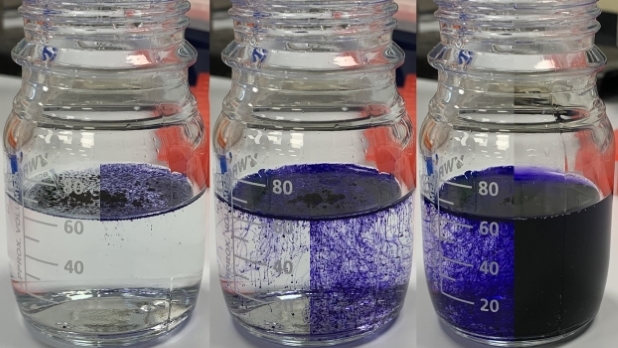 An image of three jars of liquid showing the dissolution of 'Brilliant Blue' tracking how it transforms a clear liquid into a vivid indigo