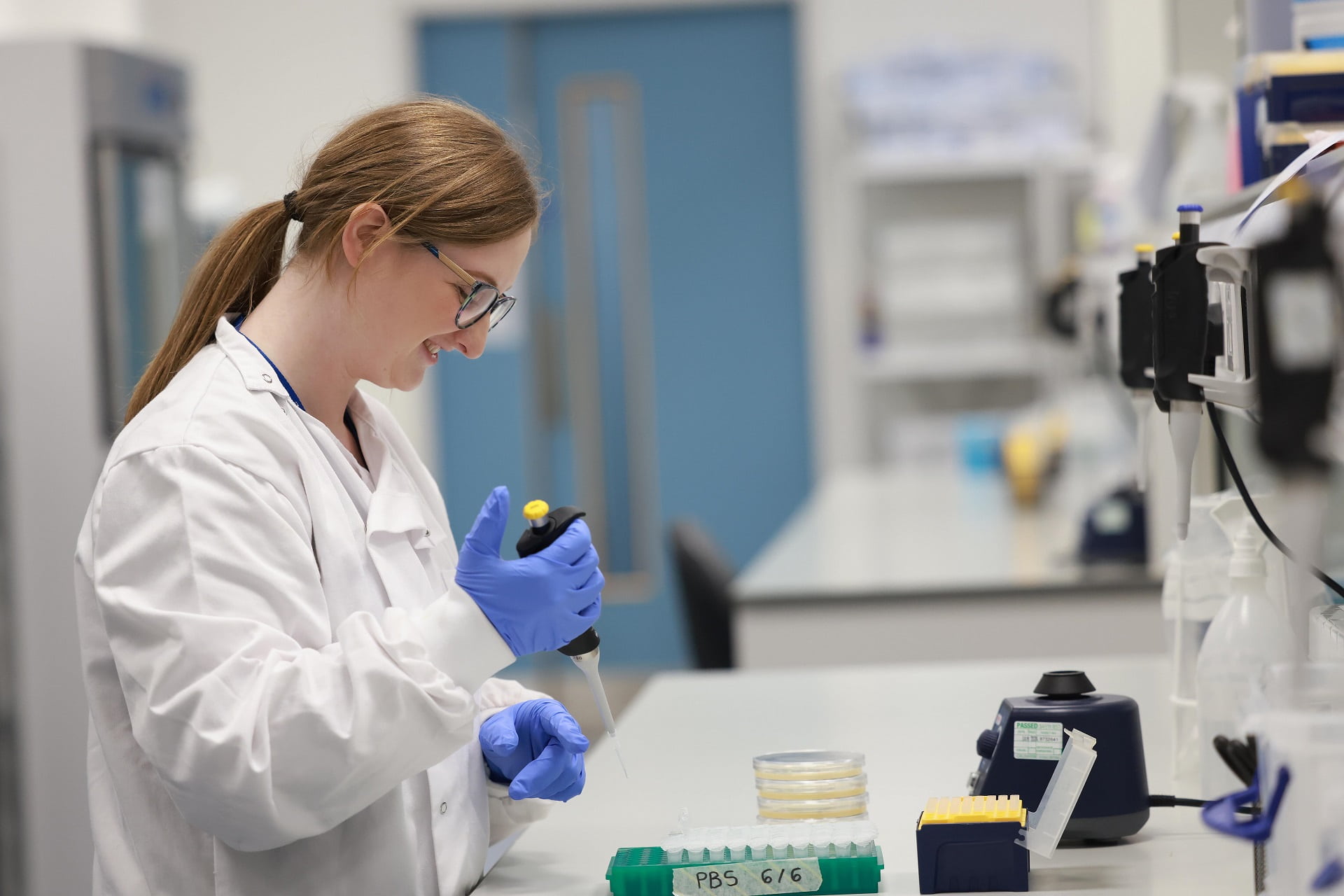 Scientist using pipette