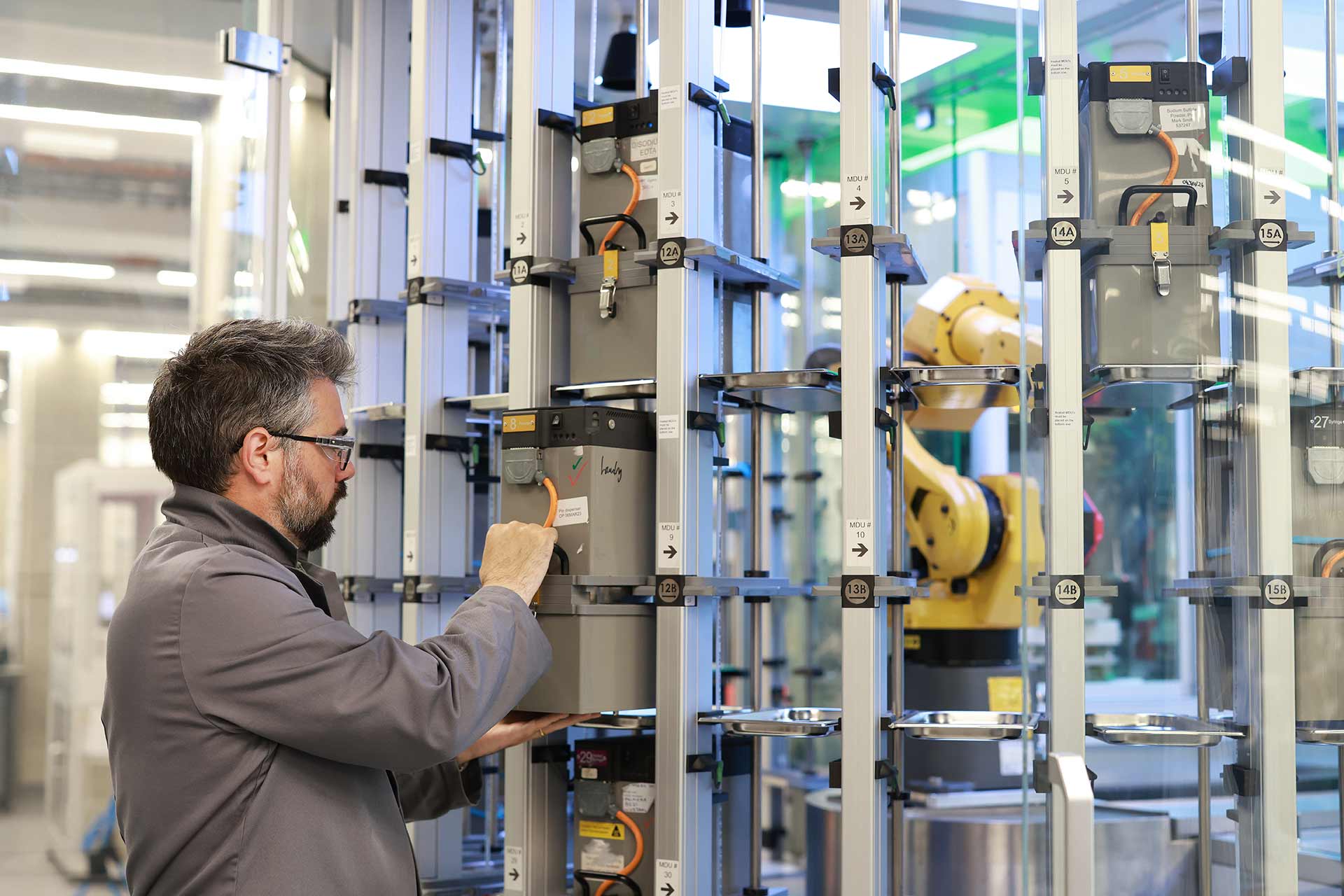 Photograph of a scientist working with machinery in a lab